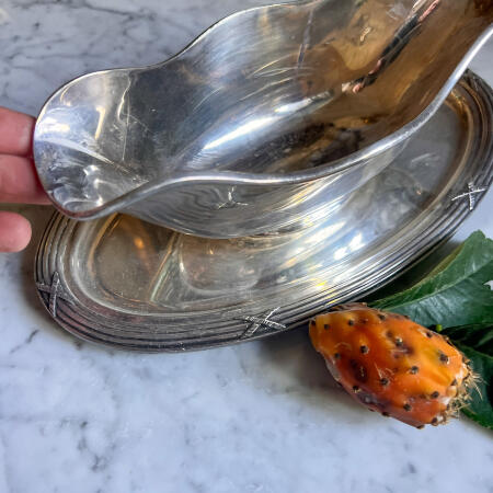 Sauce boat on a cast platter, England