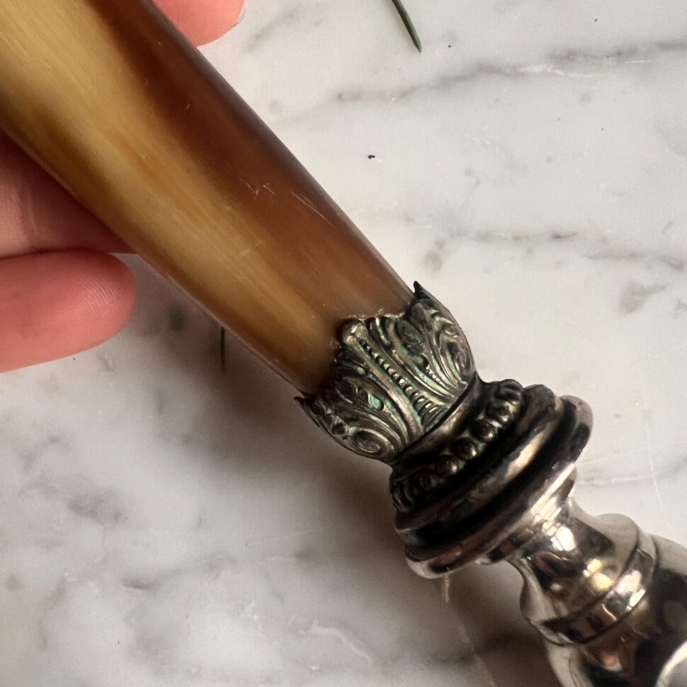 Meat clamp, cow horn and silverplate, France, 1920s, length 22 cm