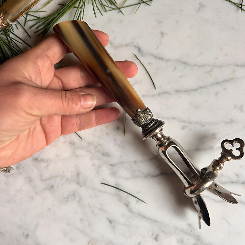 Meat clamp, cow horn and silverplate, France, 1920s, length 22 cm