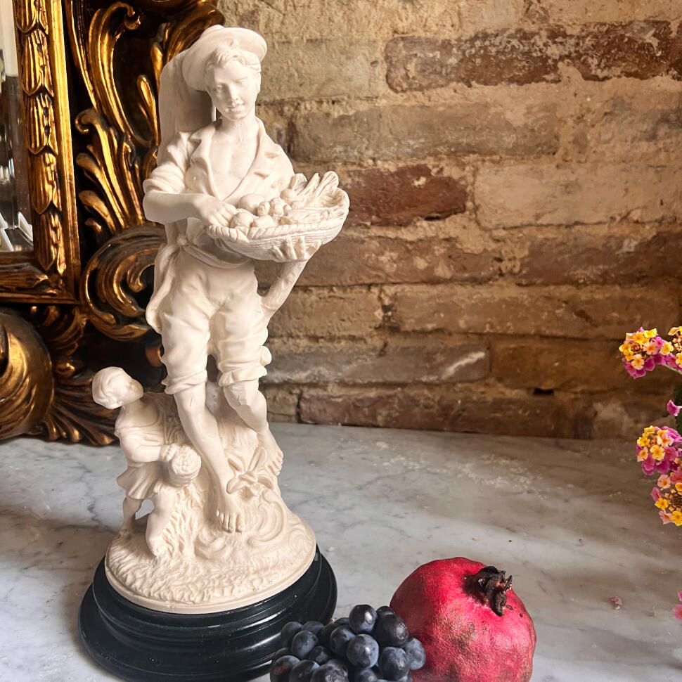 Porcelain figurine of a fruit vendor boy, Capodimonte style, height 33 cm, Italy, mid-20th century